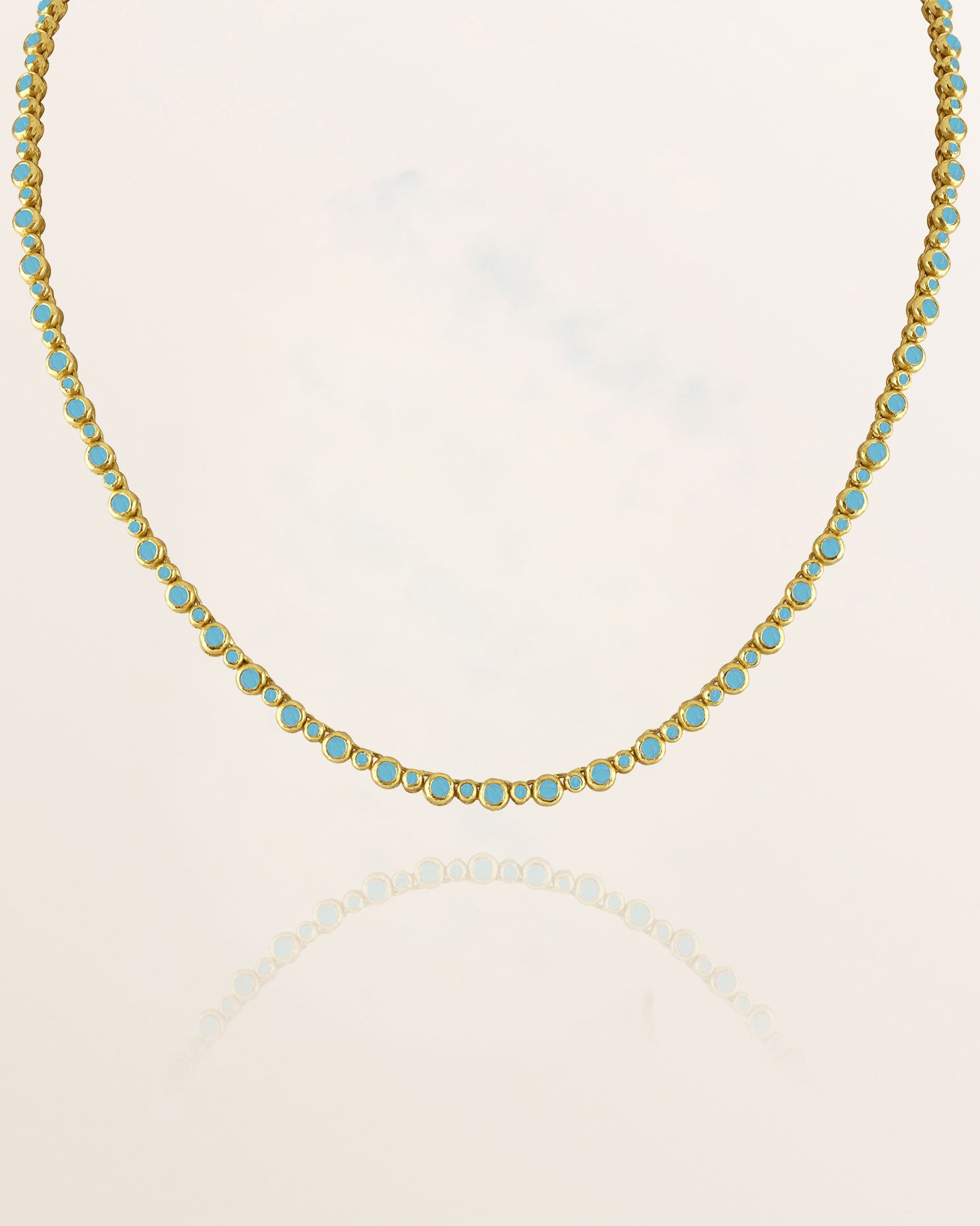 Tennis Necklace with turquoise stones on a white background