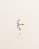 A single gold stud earring with five sparkling white stones set in high-quality 18ct gold plating, designed for comfort and waterproof.