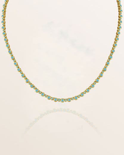 Tennis Necklace with turquoise stones on a white background